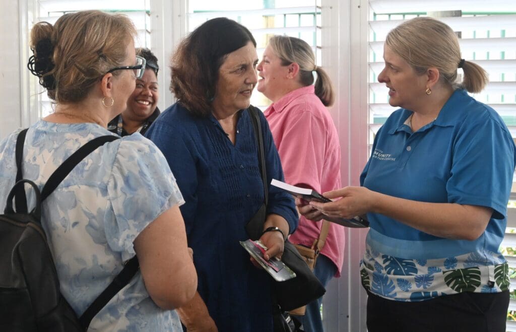 An organisation representative connecting with the TCIC General Manager at a Together Townsville Networks Networking event